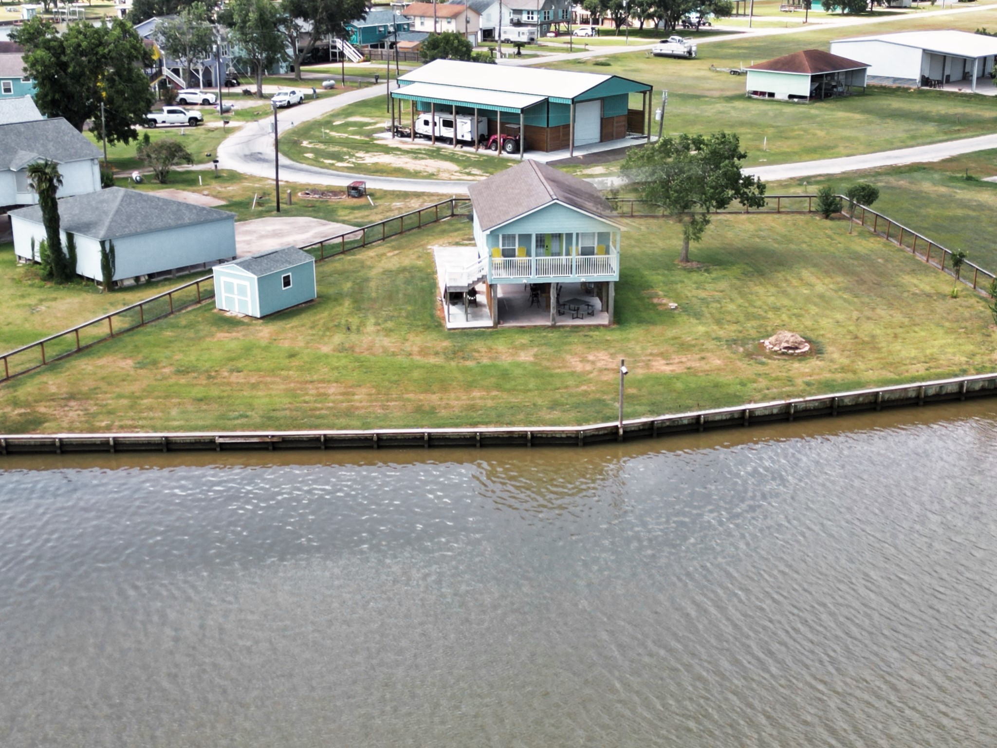 1867 County Road 291 Sargent, TX 77414 - Photo 1 of 38 an aerial view of a house with swimming pool