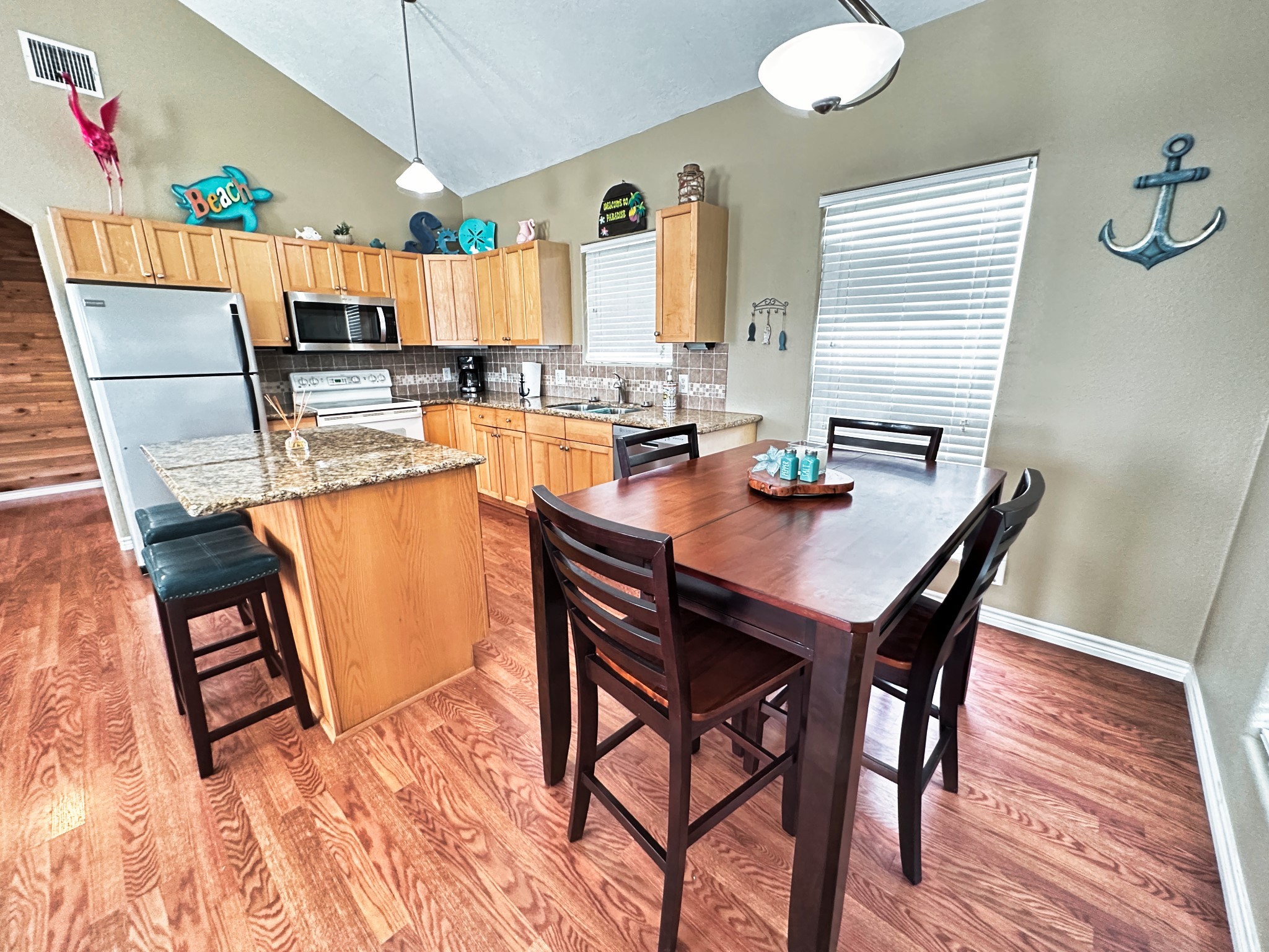 1867 County Road 291 Sargent, TX 77414 - Photo 12 of 38 a view of a dining room with furniture and wooden floor