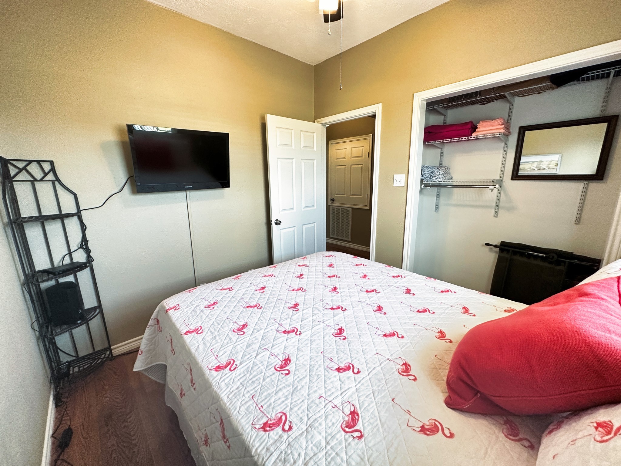 1867 County Road 291 Sargent, TX 77414 - Photo 19 of 38 a bedroom with a bed and a flat screen tv