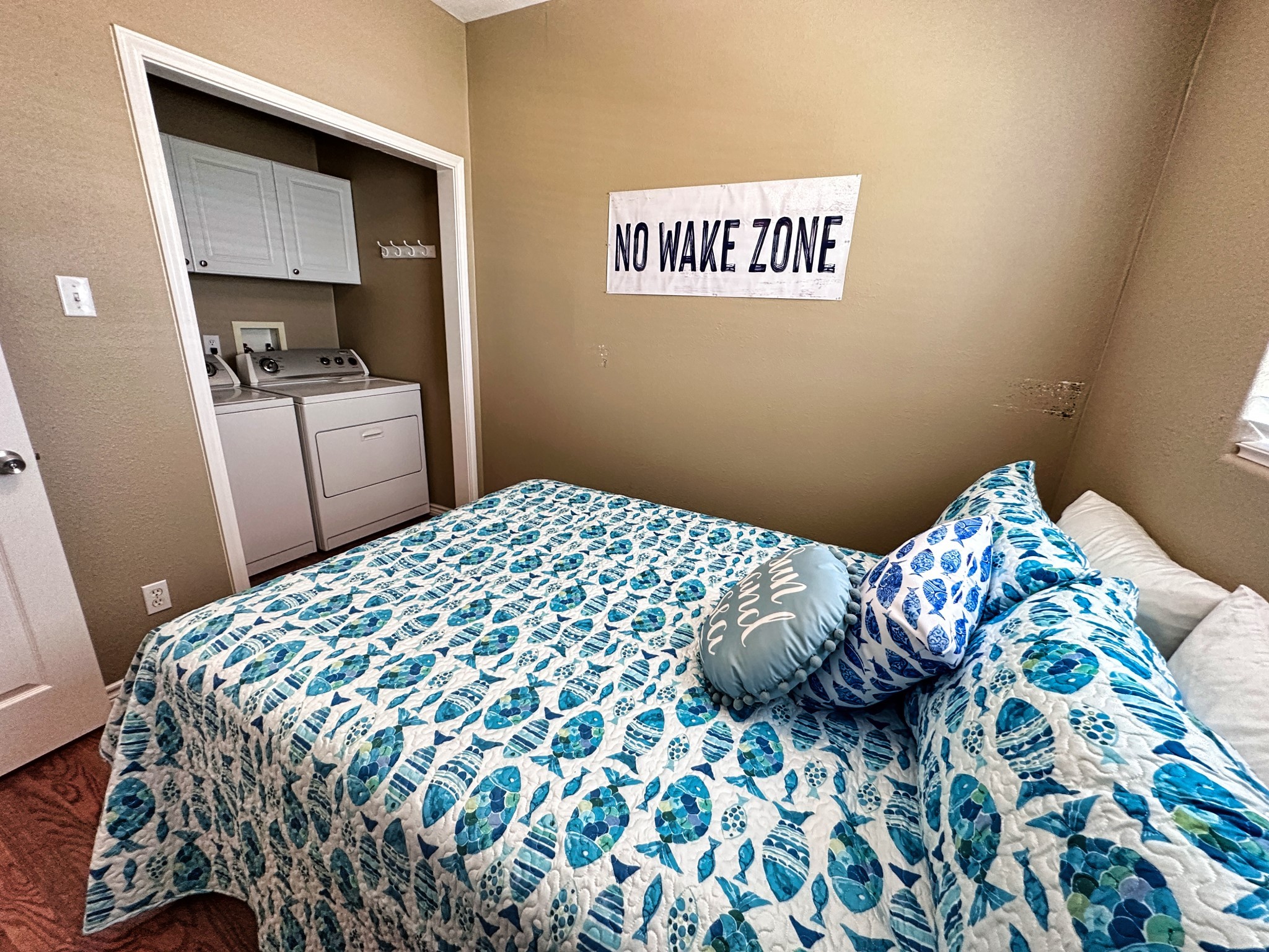 1867 County Road 291 Sargent, TX 77414 - Photo 20 of 38 a bedroom with a bed and a chair