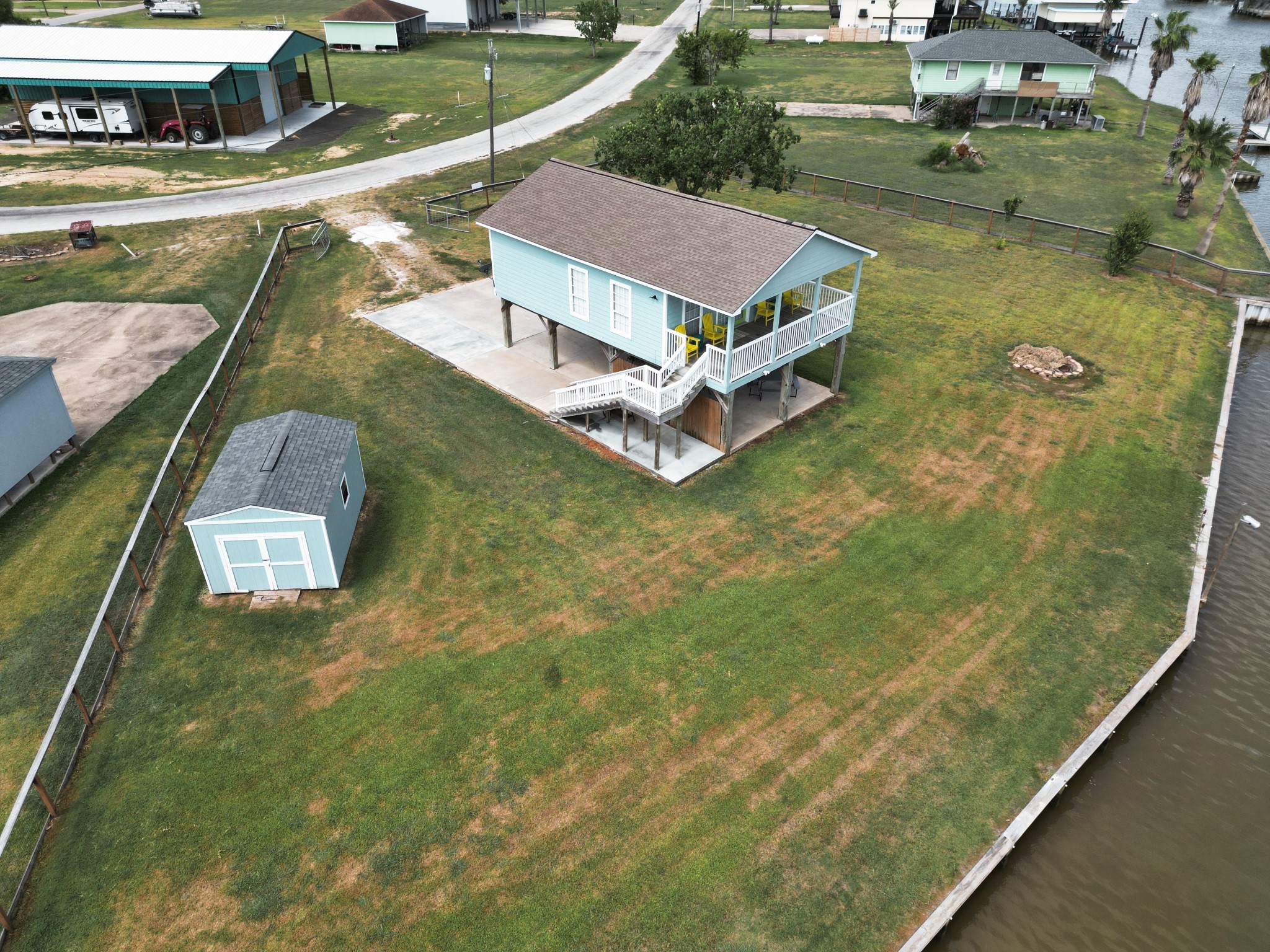 1867 County Road 291 Sargent, TX 77414 - Photo 2 of 38 an aerial view of residential houses with outdoor space