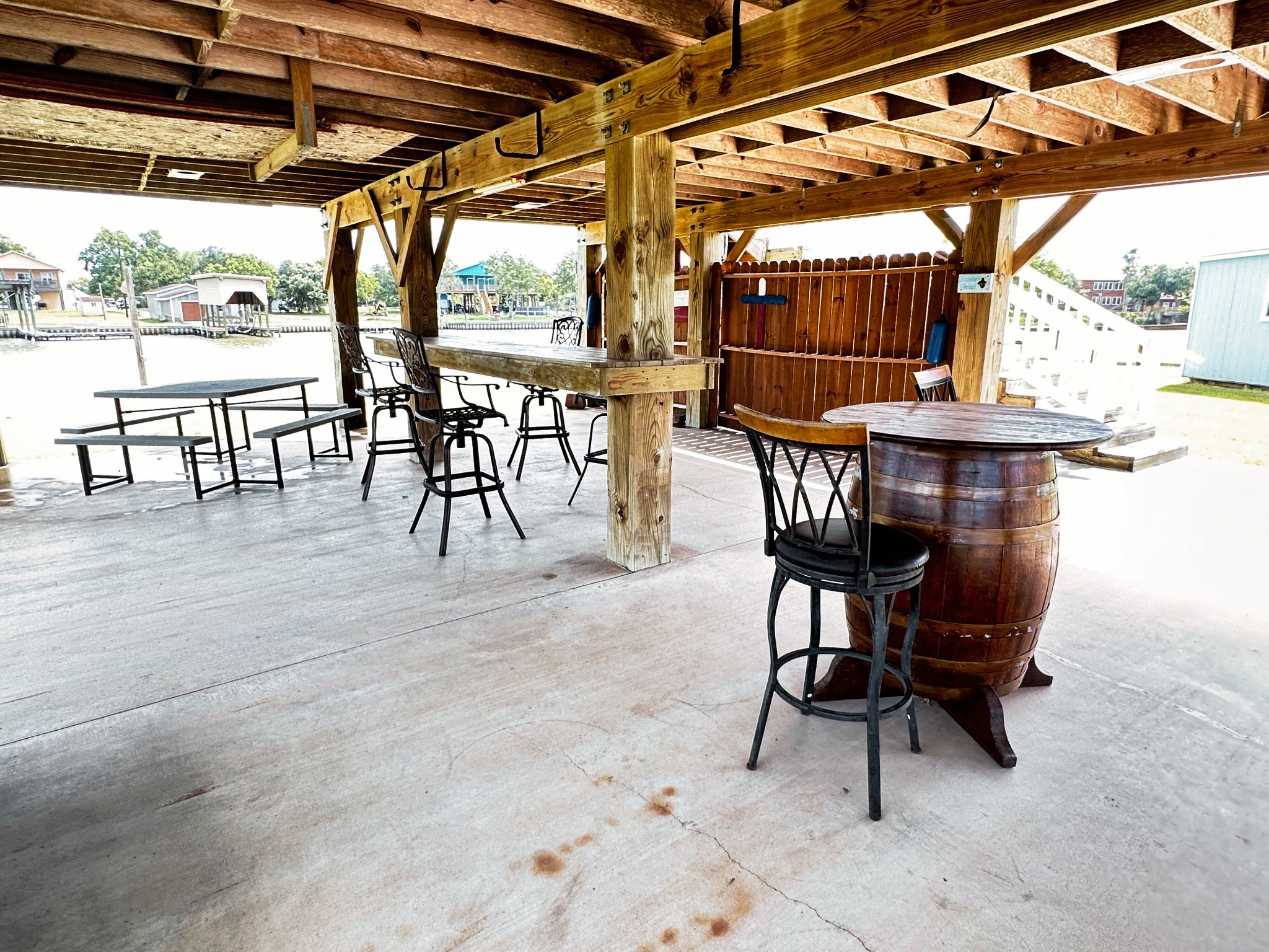 1867 County Road 291 Sargent, TX 77414 - Photo 27 of 38 a view of a chairs and table in the patio