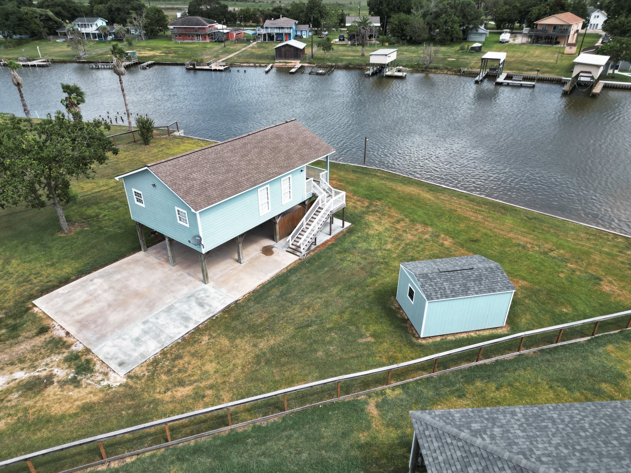 1867 County Road 291 Sargent, TX 77414 - Photo 3 of 38 a view of a pool with lawn chairs and plants