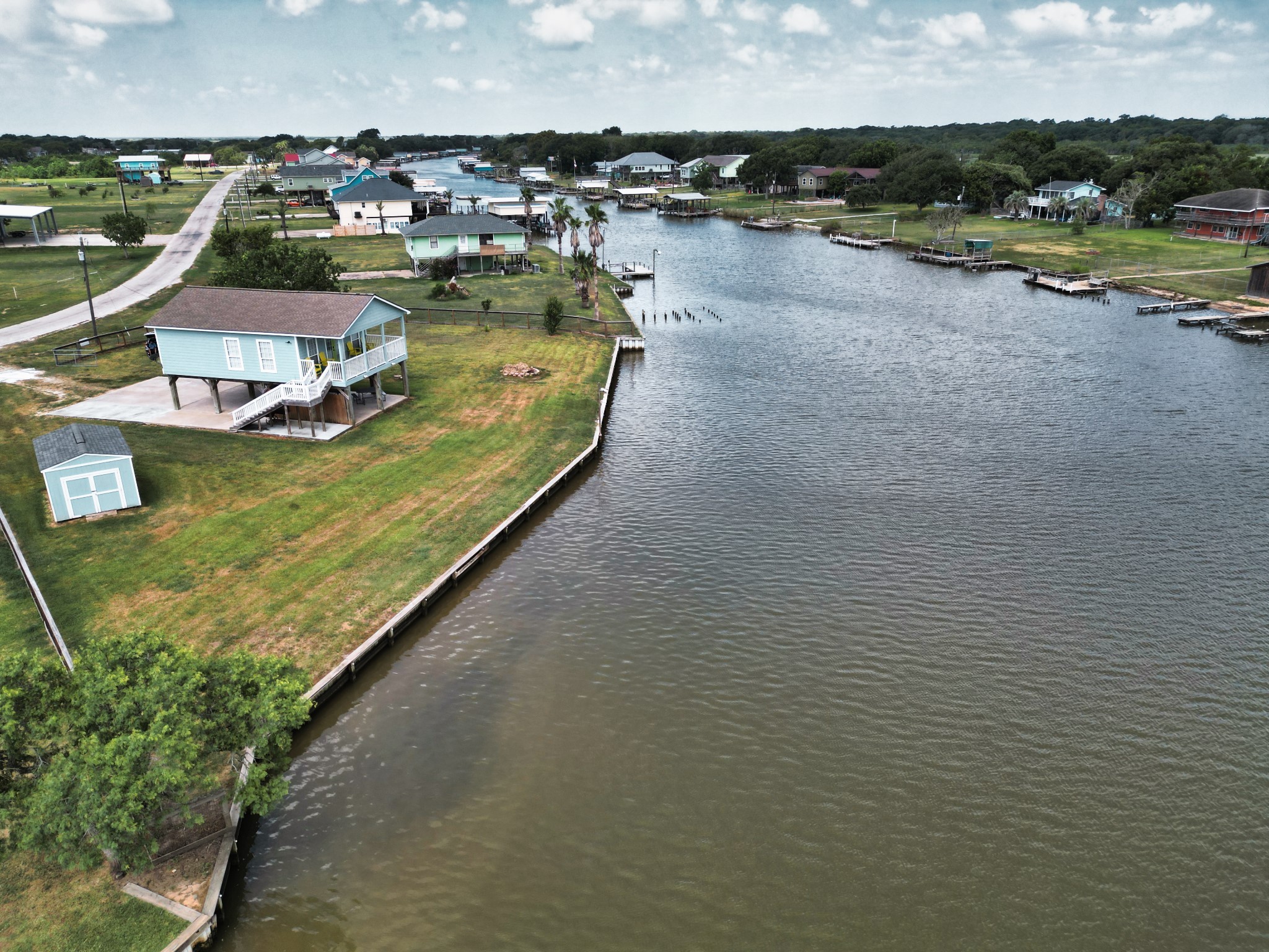 1867 County Road 291 Sargent, TX 77414 - Photo 34 of 38 a view of a lake with outdoor space