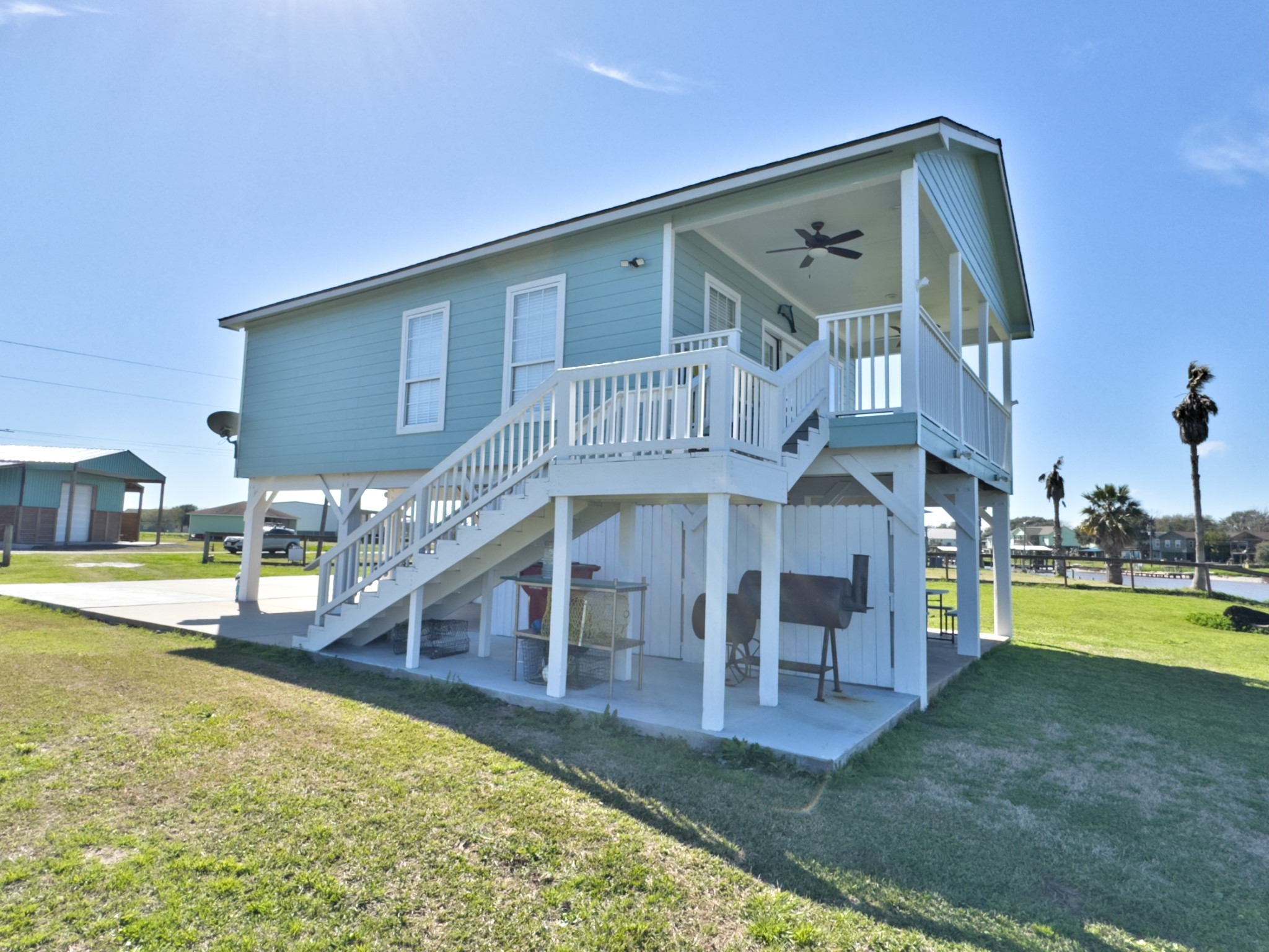 1867 County Road 291 Sargent, TX 77414 - Photo 6 of 38 a view of a house with swimming pool and sitting area