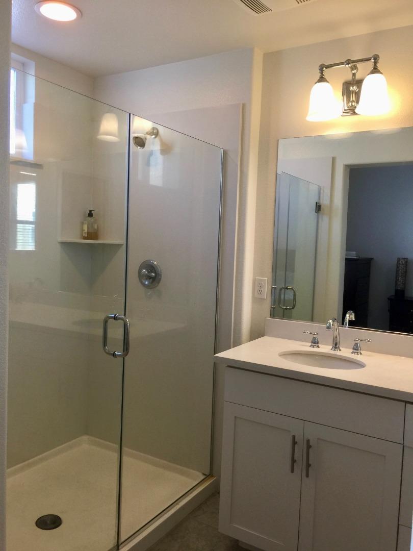 458 Landeros Drive San Mateo, CA 94403 - Photo 15 of 42 a bathroom with a sink mirror shower and a mirror
