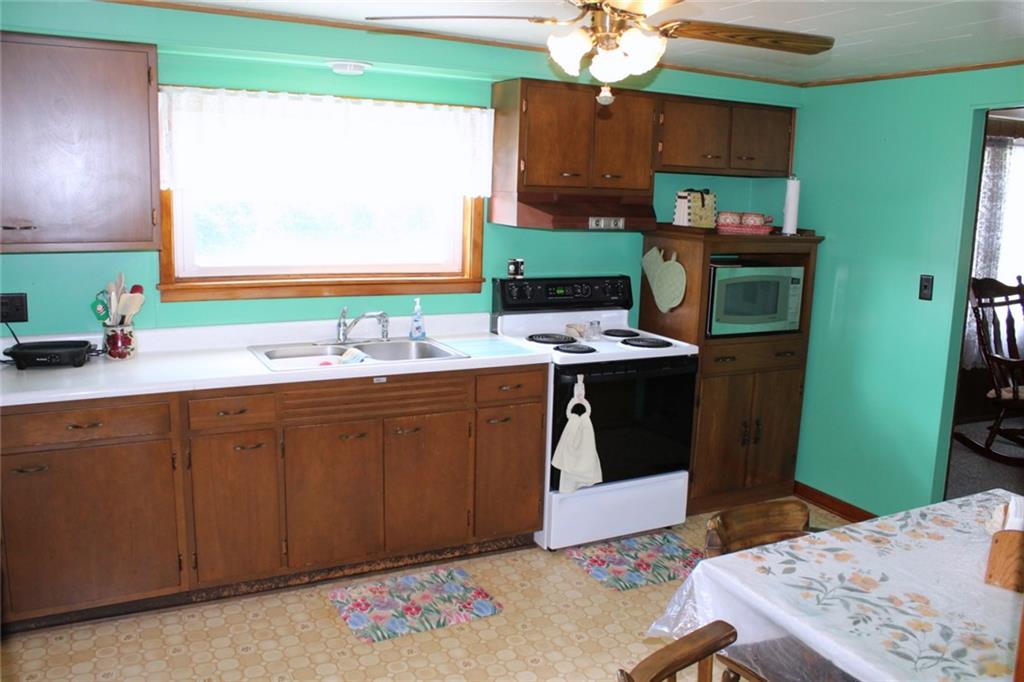 640 Cherry Road Chicora, PA 16025 - Photo 11 of 24 a kitchen with a sink cabinets and window