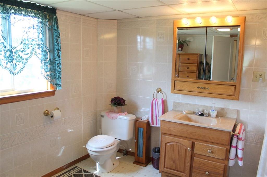 640 Cherry Road Chicora, PA 16025 - Photo 13 of 24 a bathroom with a sink toilet and shower