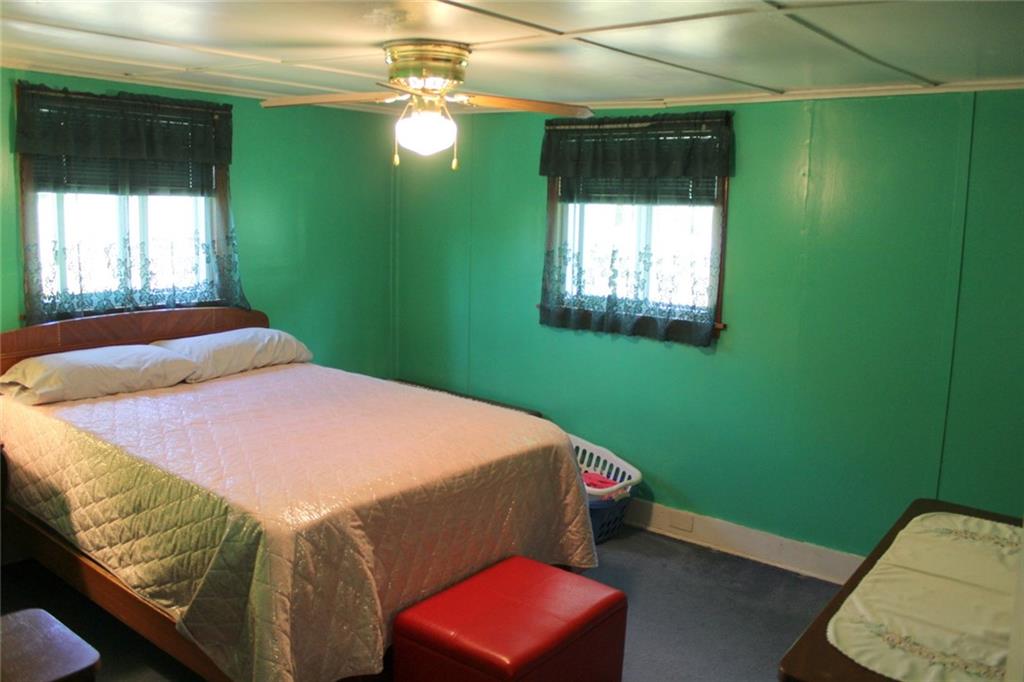 640 Cherry Road Chicora, PA 16025 - Photo 14 of 24 a bedroom with a bed and a window