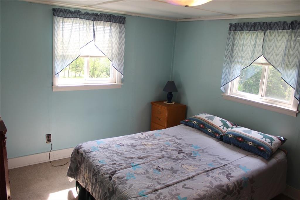 640 Cherry Road Chicora, PA 16025 - Photo 17 of 24 a bedroom with a bed and a window