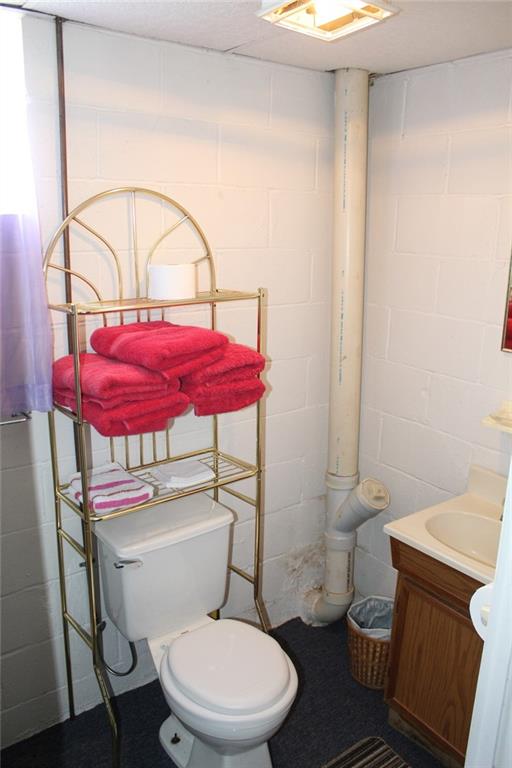 640 Cherry Road Chicora, PA 16025 - Photo 19 of 24 a white toilet sitting next to a bathroom sink