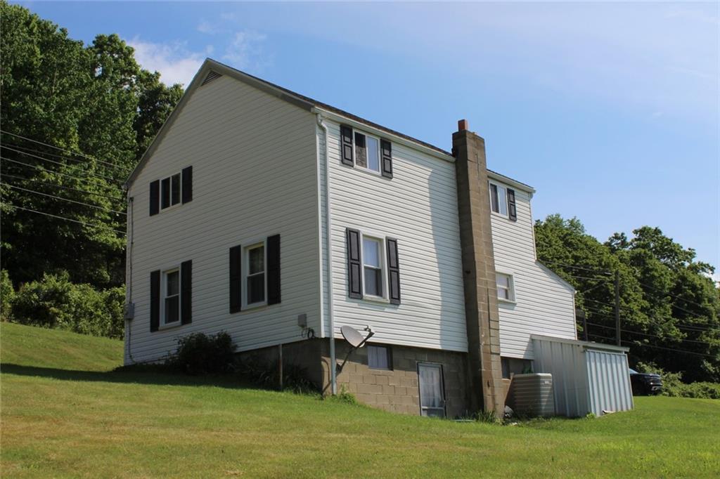 640 Cherry Road Chicora, PA 16025 - Photo 24 of 24 a front view of a house with a yard