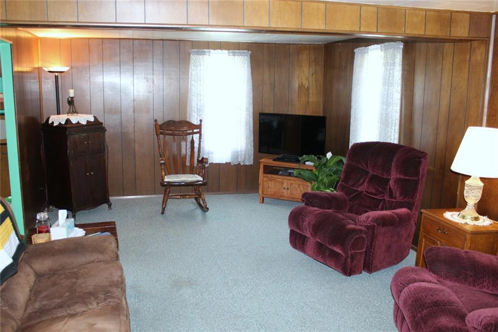 640 Cherry Road Chicora, PA 16025 - Photo 8 of 24 a living room with furniture and a flat screen tv