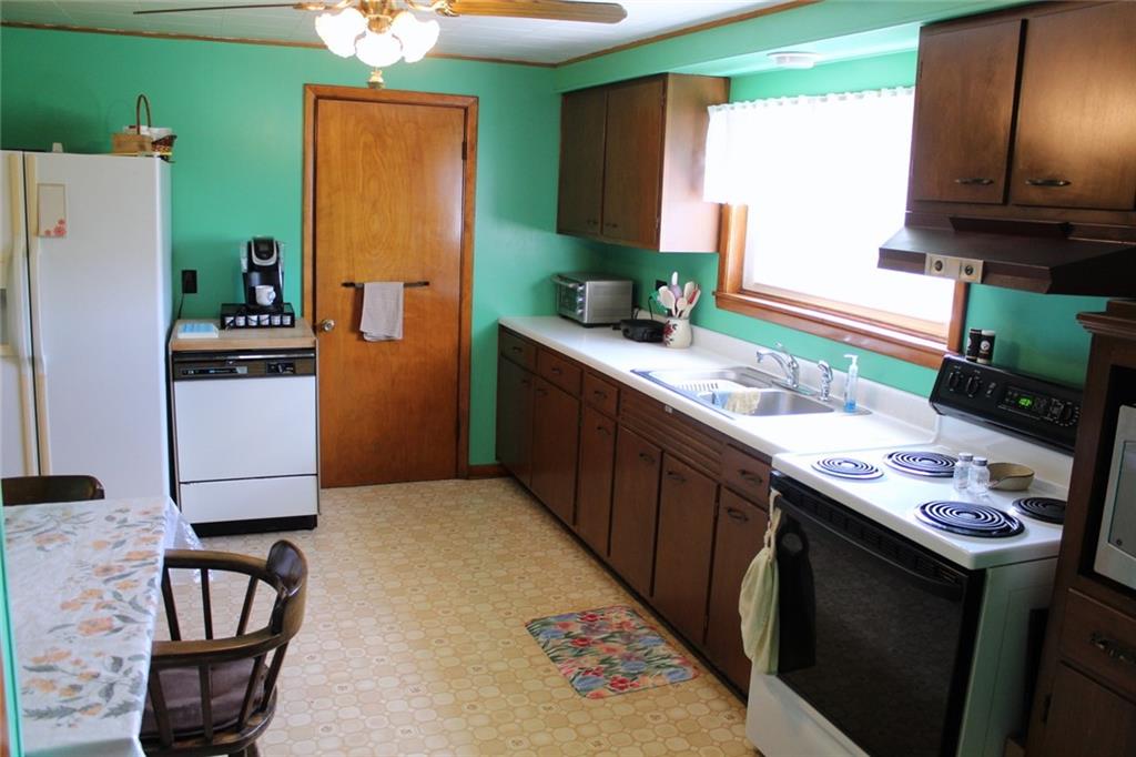 640 Cherry Road Chicora, PA 16025 - Photo 10 of 24 a kitchen with stainless steel appliances granite countertop a sink stove and refrigerator
