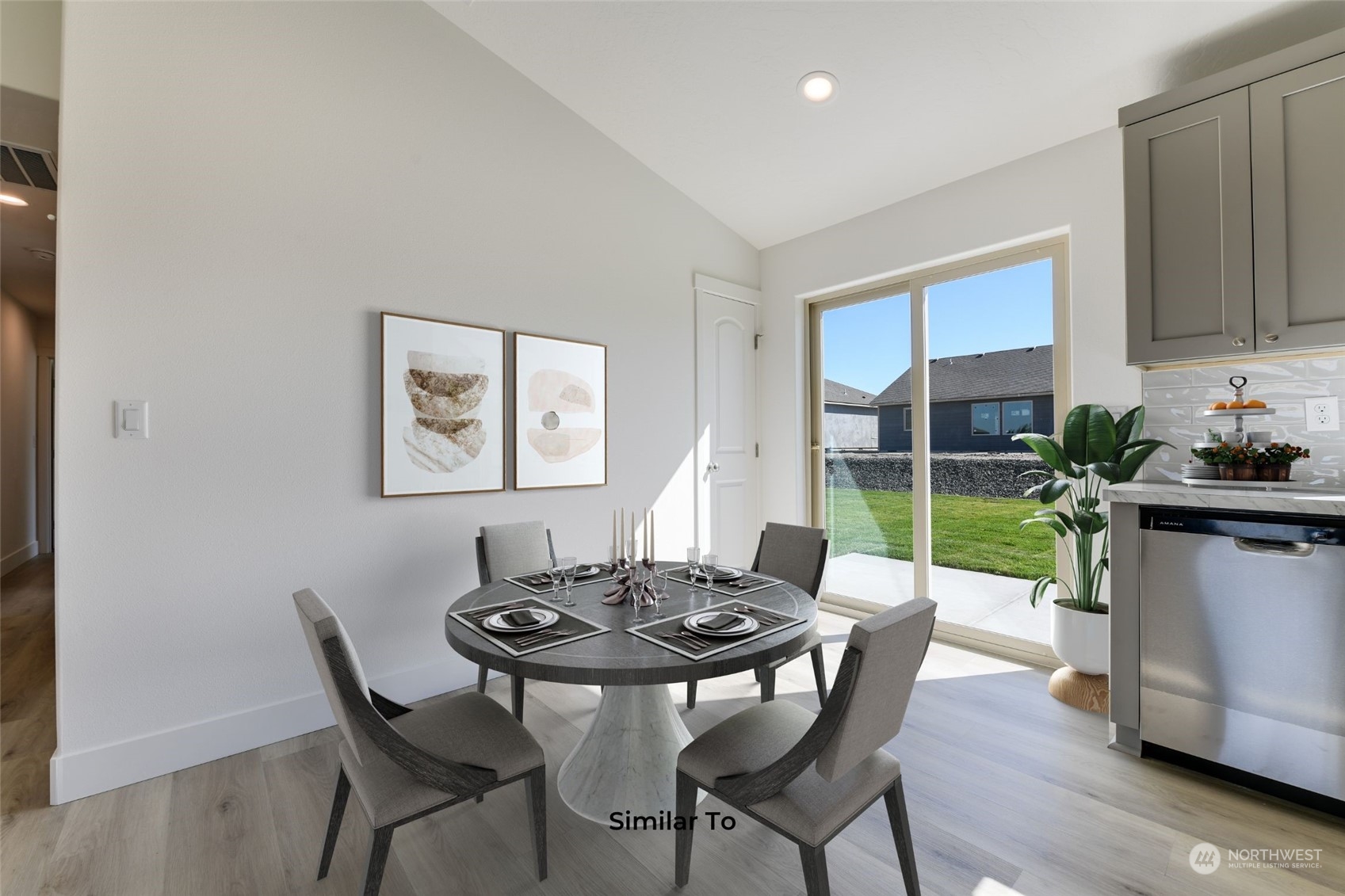 209 North Sandy Loop Moses Lake, WA 98837 - Photo 7 of 19 a view of a dining room with furniture window and wooden floor
