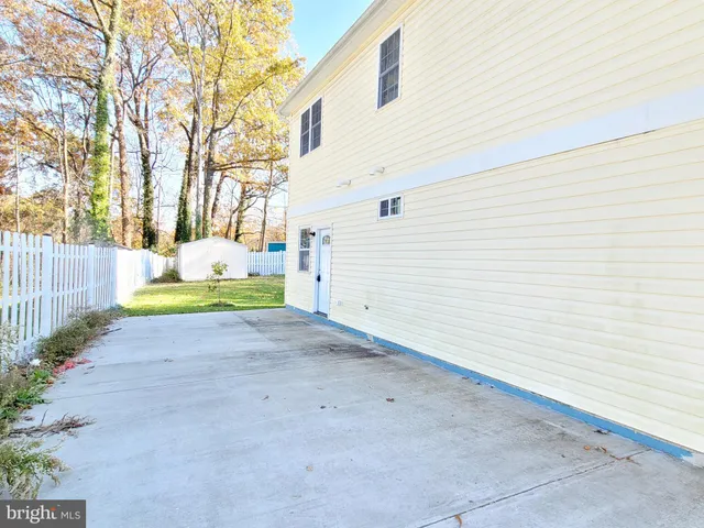 a bath tub sitting next to a bathroom sink