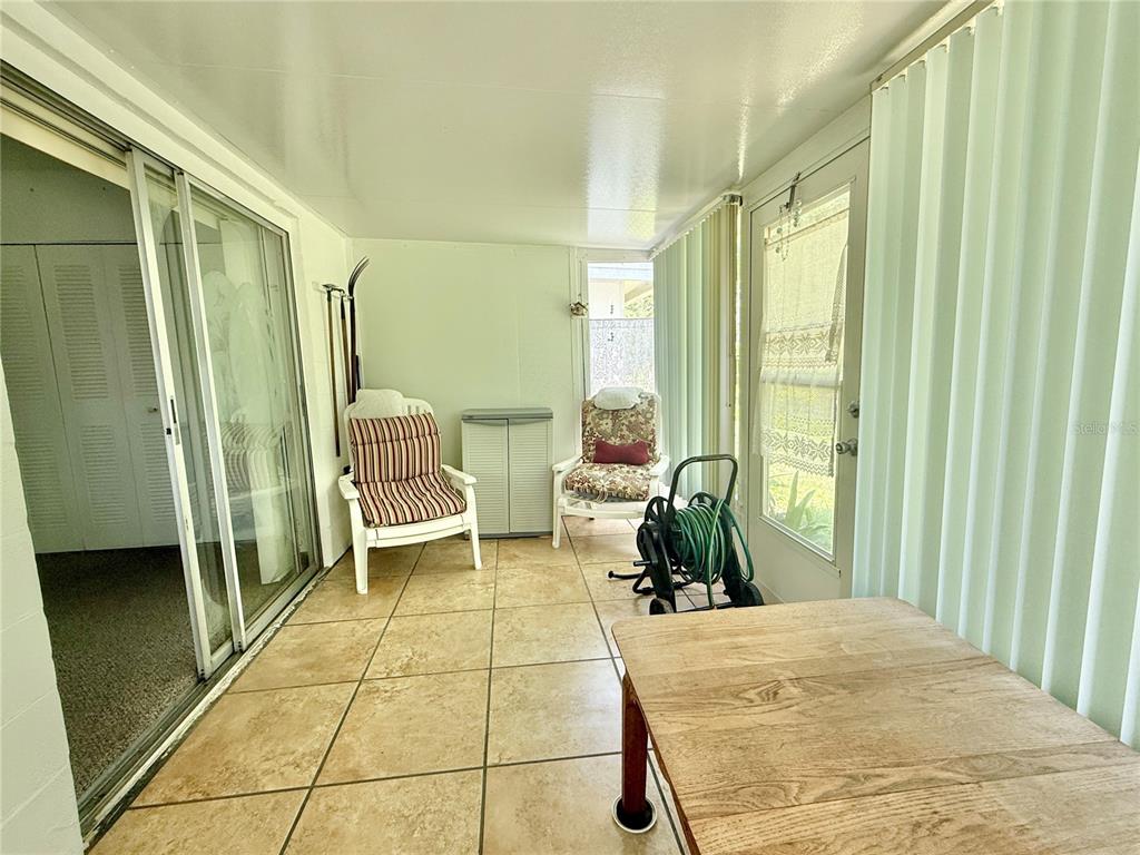 11911 Bayonet Lane New Port Richey, FL 34654 - Photo 11 of 26 a bedroom with a bed and a large window