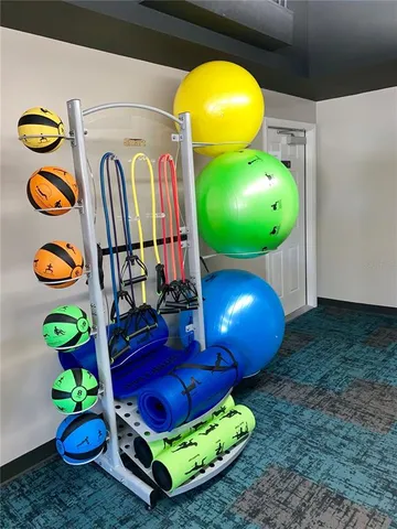 a room with pool table and windows