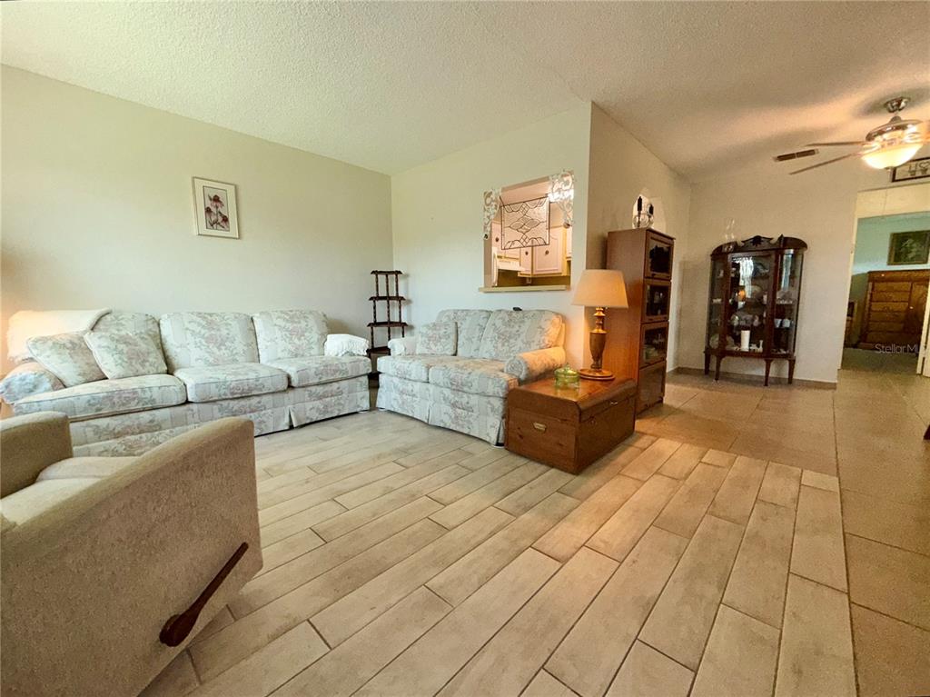 11911 Bayonet Lane New Port Richey, FL 34654 - Photo 3 of 26 a living room with furniture and a couch