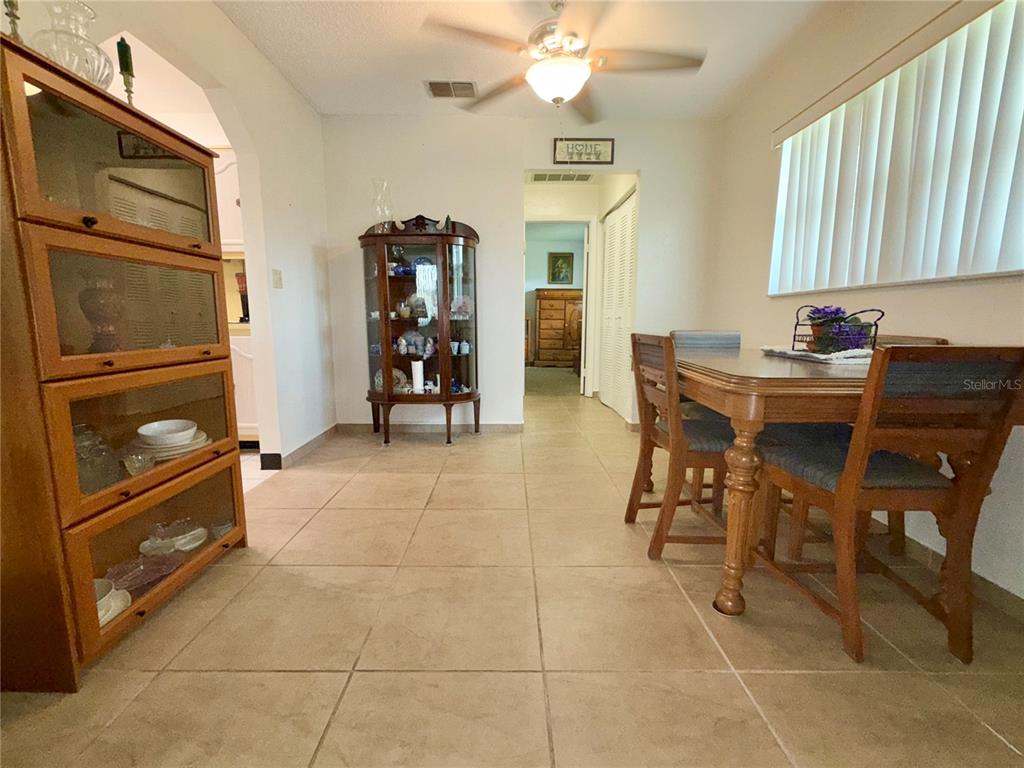 11911 Bayonet Lane New Port Richey, FL 34654 - Photo 4 of 26 a view of a dining room with furniture and chandelier
