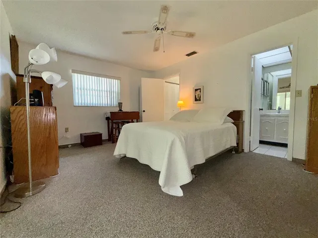 a bedroom with bed and window