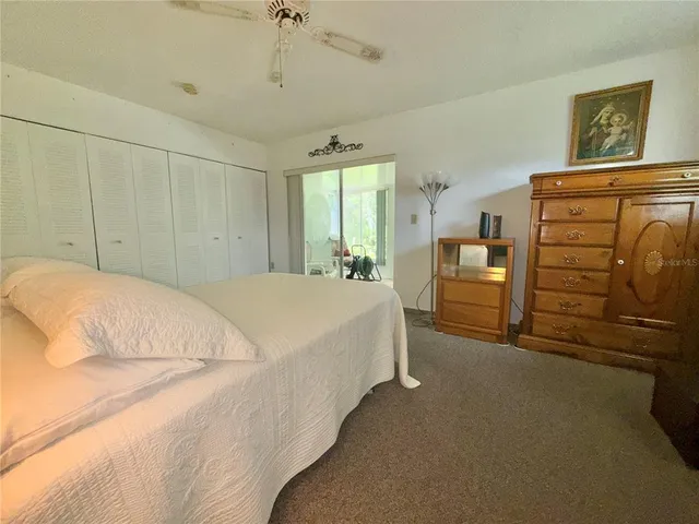 a bedroom with a bed and a closet