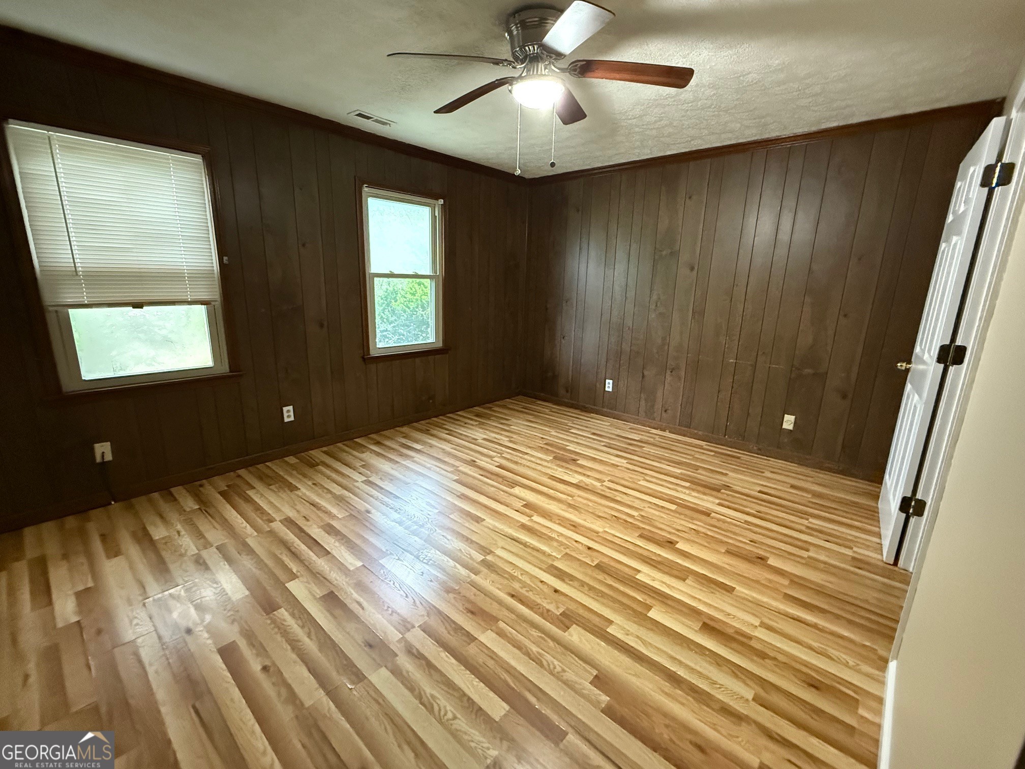 2691 Falcon Ridge Drive Southwest Grayson, GA 30017 - Photo 9 of 10 wooden floor in an empty room with a window
