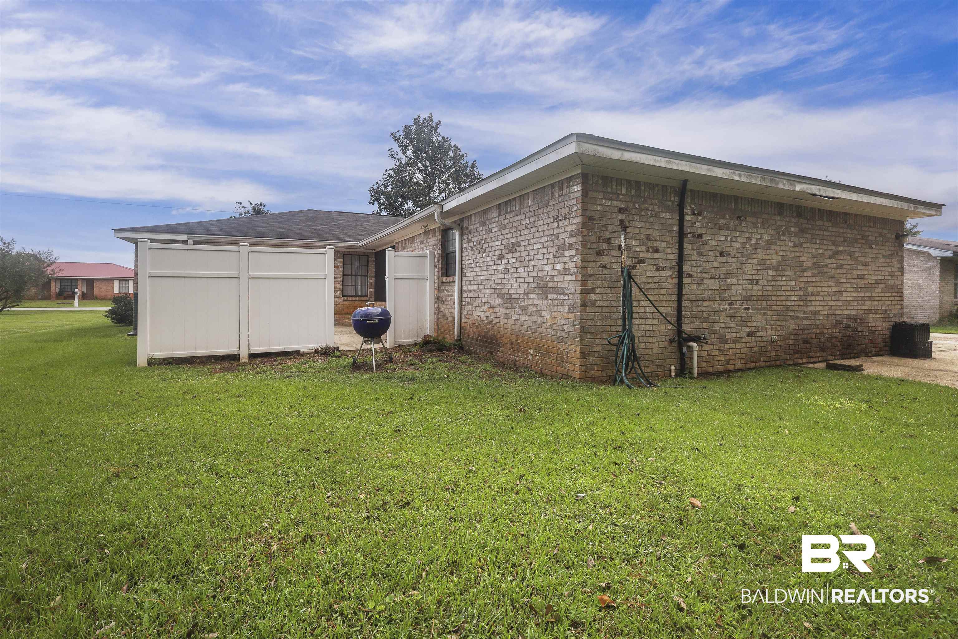 507 West Amanda Avenue Foley, AL 36535 - Photo 21 of 23 View of home's exterior with a yard