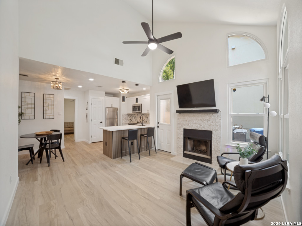 3439 Ridge Ranch San Antonio, TX 78247 - Photo 1 of 25 a living room with furniture a fireplace and a flat screen tv