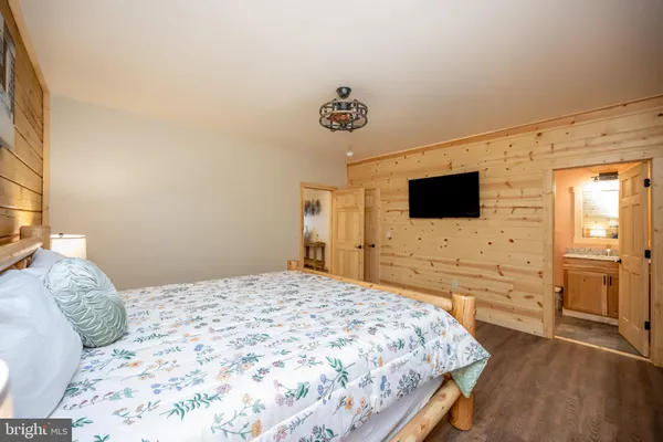 a bedroom with a bed and a table