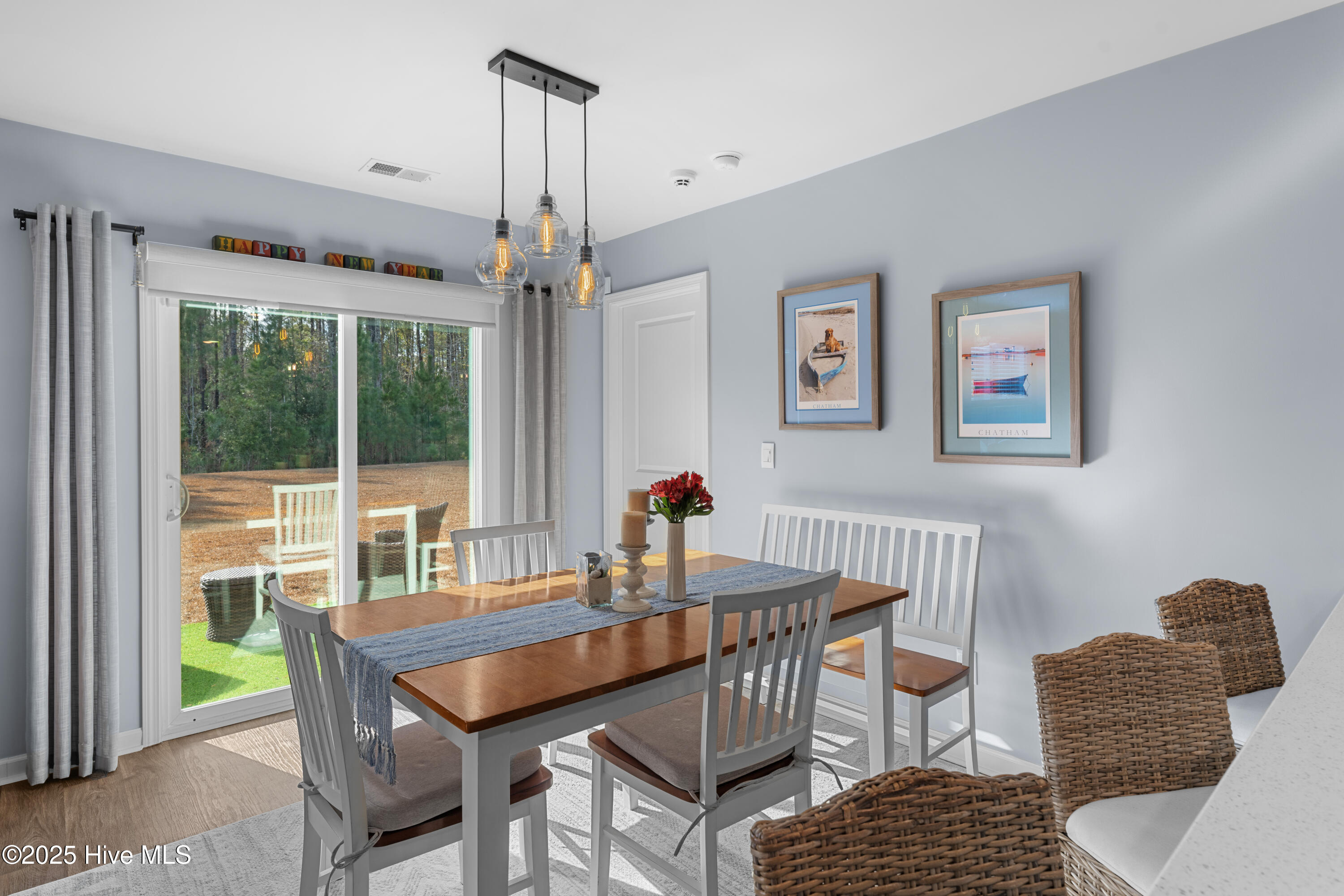 776 Buckeye Road Northeast Leland, NC 28451 - Photo 26 of 42 Dining Room with Large Sliding Doors providing Views into the Large backyard.