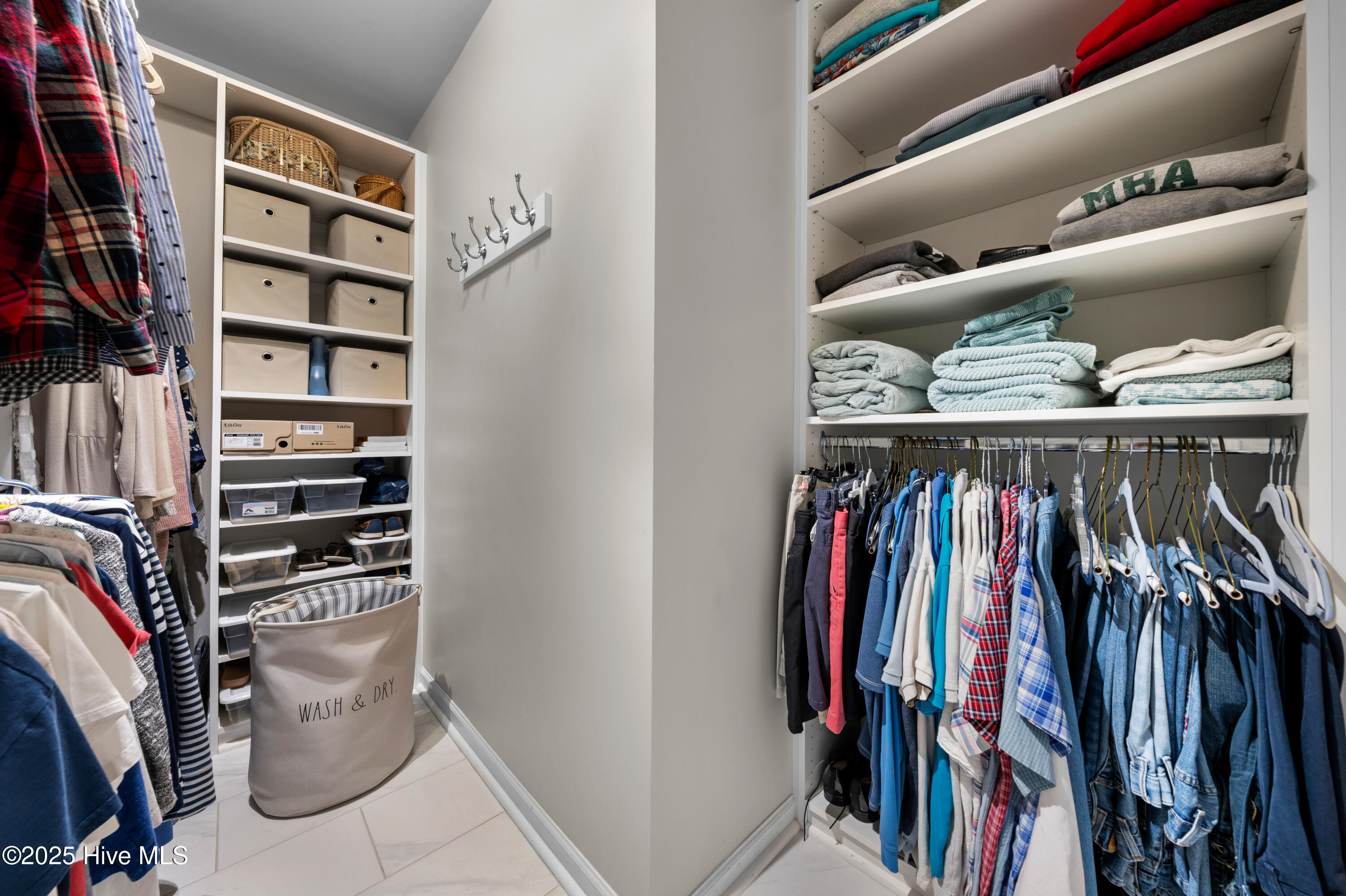 776 Buckeye Road Northeast Leland, NC 28451 - Photo 31 of 42 Owners Closet with Professionally installed custom cabinetry