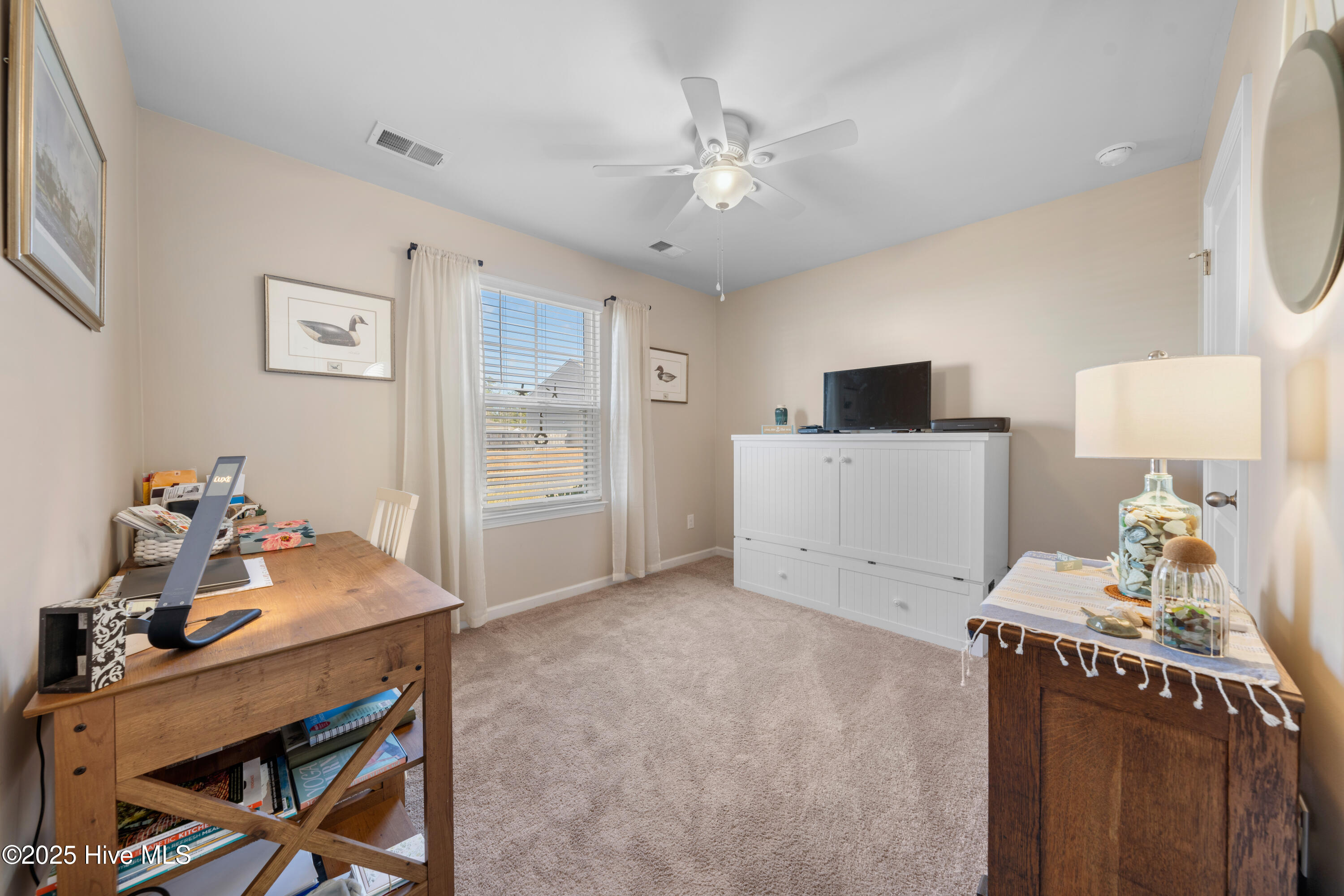 776 Buckeye Road Northeast Leland, NC 28451 - Photo 35 of 42 Guest Bedroom #2 or can be used as an Office/Craft room with Custom Cabinetry in the closet