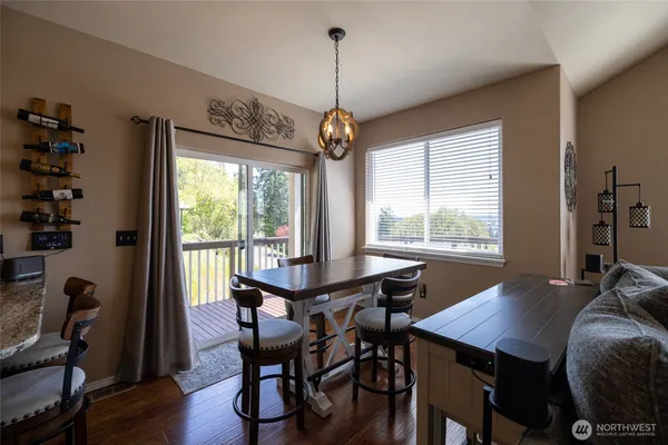 a view of a dining room with furniture window and outside view