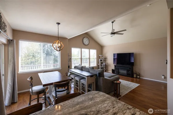 a view of a livingroom with furniture window and wooden floor