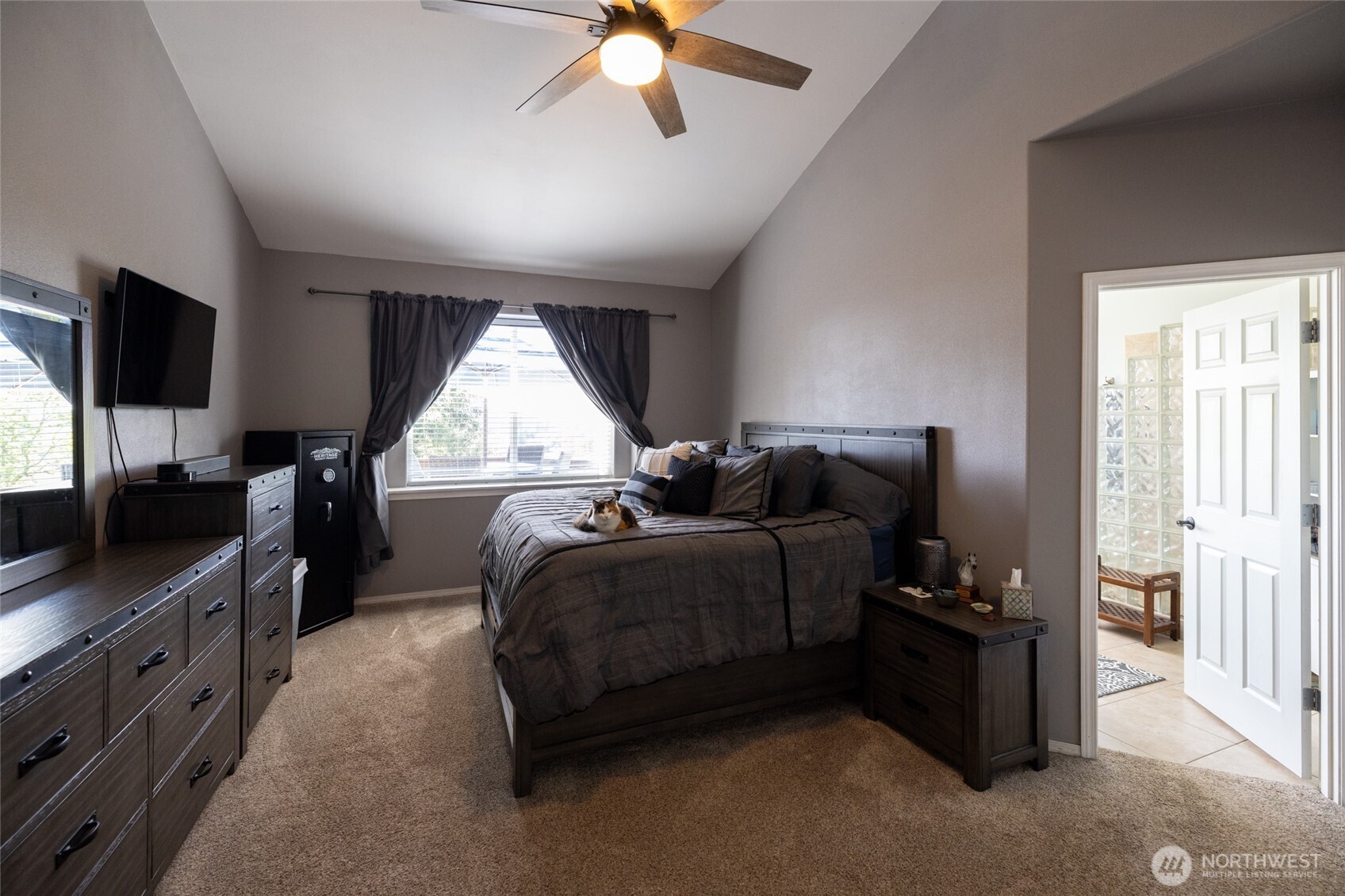 1895 Southeast Maple Drive Chehalis, WA 98532 - Photo 16 of 35 a spacious bedroom with a bed and a flat screen tv