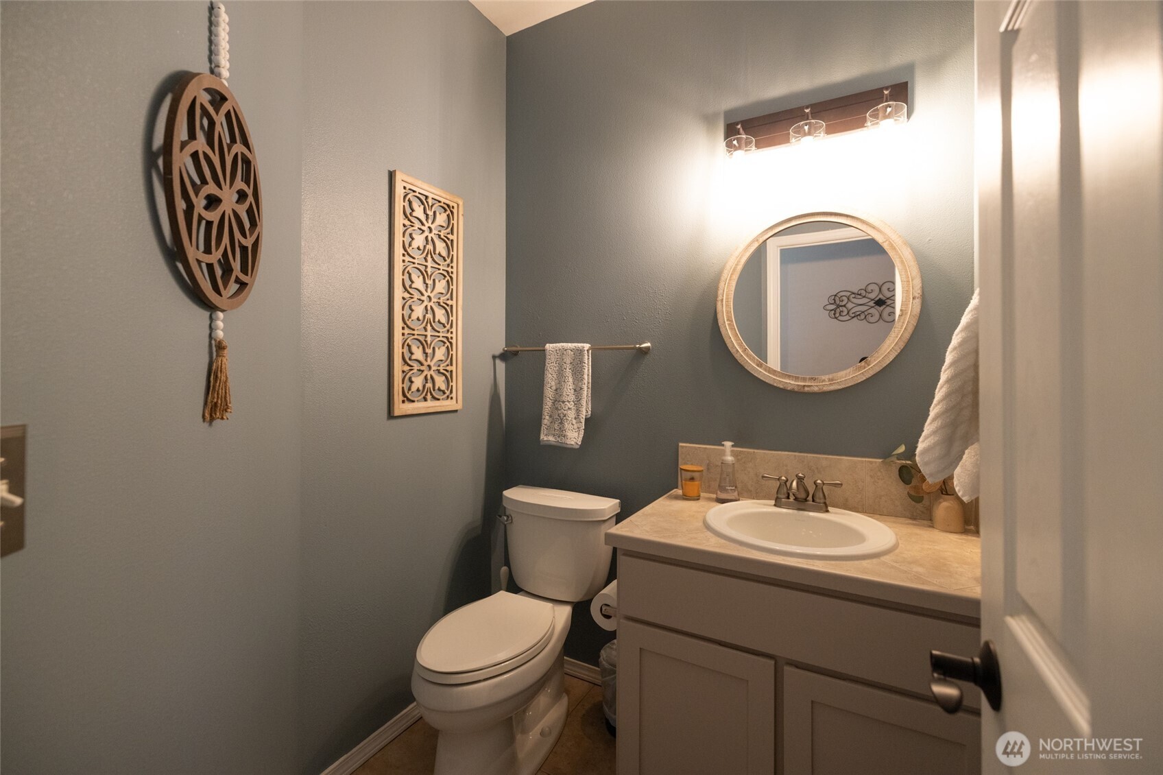 1895 Southeast Maple Drive Chehalis, WA 98532 - Photo 21 of 35 a bathroom with a toilet sink vanity and mirror