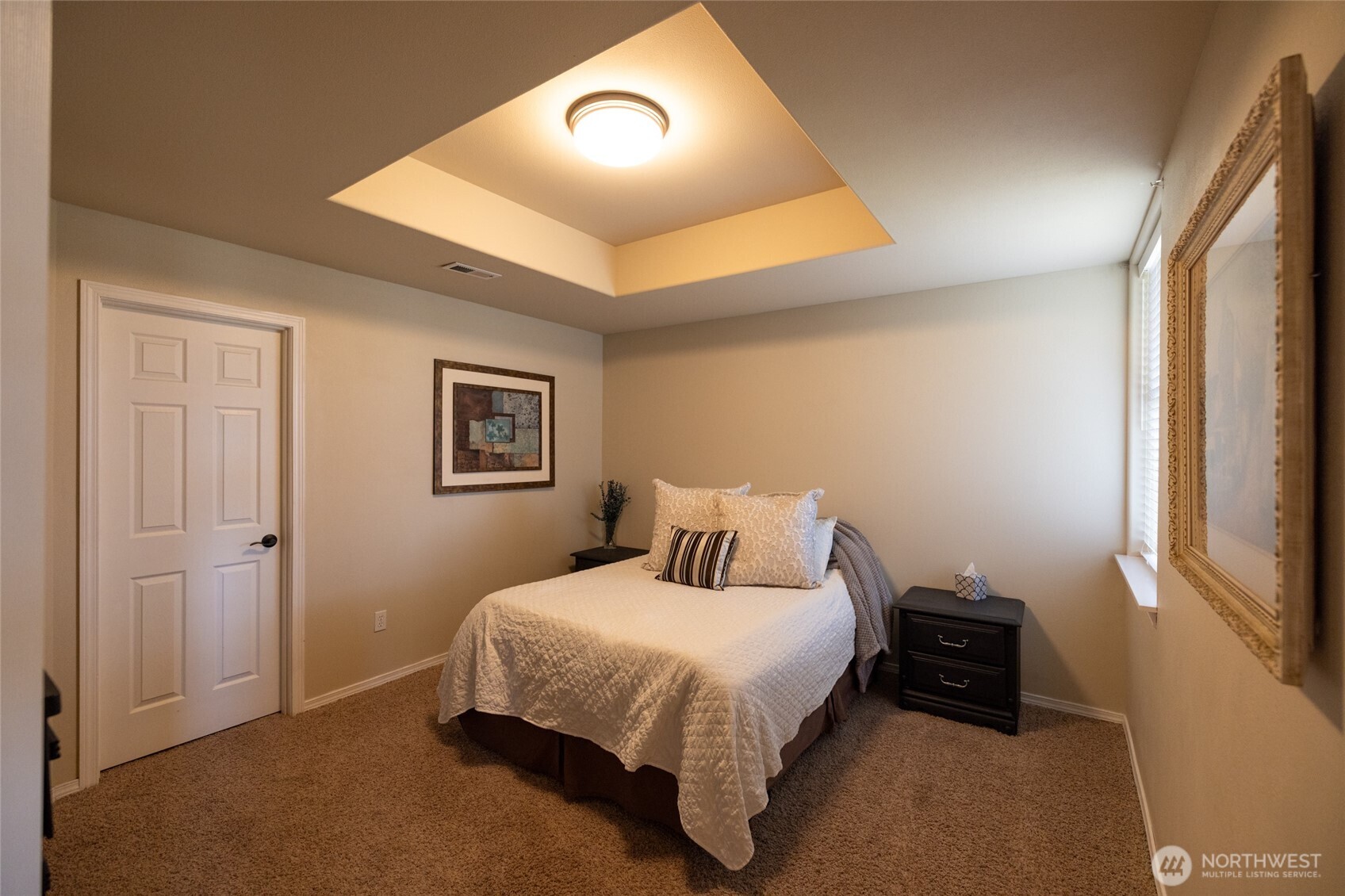 1895 Southeast Maple Drive Chehalis, WA 98532 - Photo 30 of 35 a bedroom with a bed and a painting on the wall