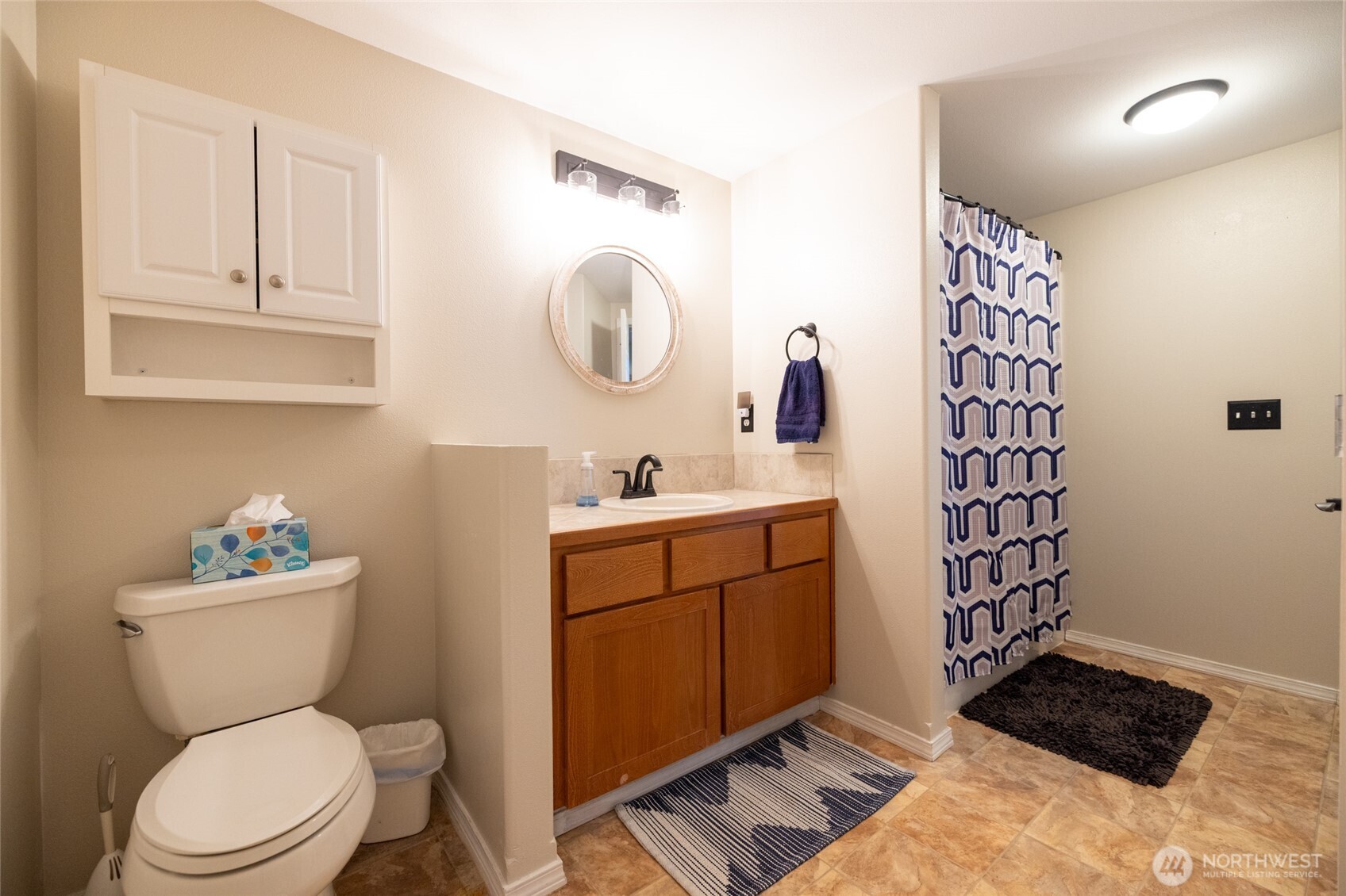1895 Southeast Maple Drive Chehalis, WA 98532 - Photo 31 of 35 a bathroom with a toilet a sink and a mirror