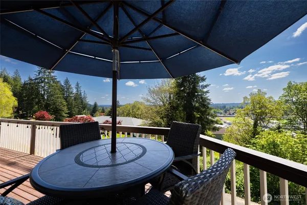 a balcony view with a seating space