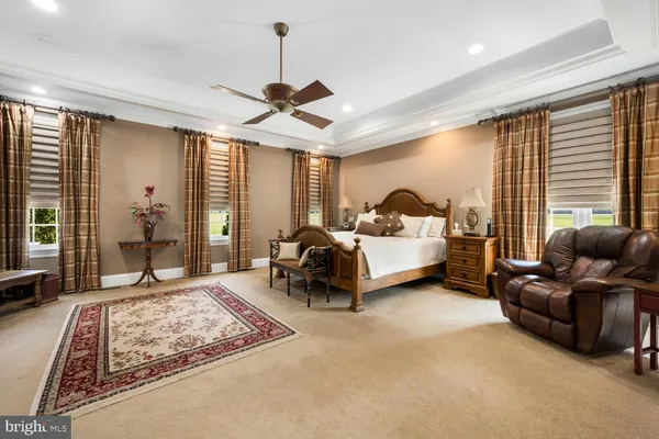 a front view of a house with a yard table and chairs