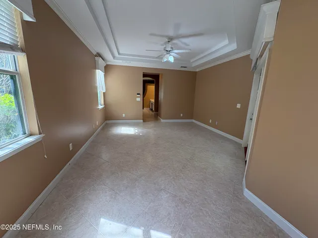 a view of an empty room and glass door