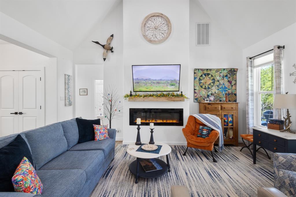 116 Lindsey Lane Runaway Bay, TX 76426 - Photo 11 of 35 a living room with furniture and a fireplace