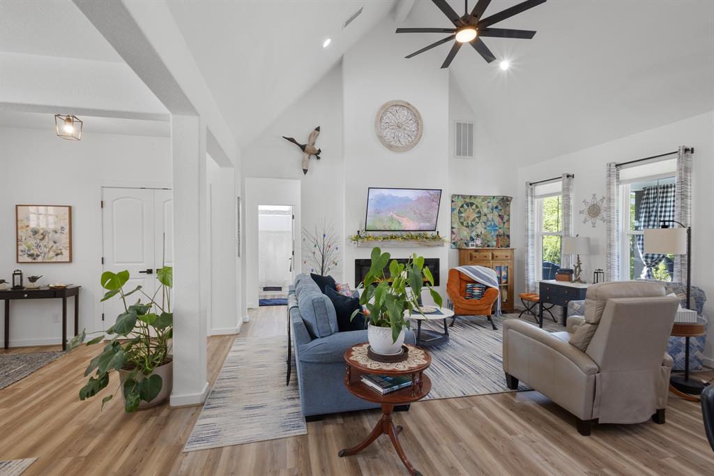 116 Lindsey Lane Runaway Bay, TX 76426 - Photo 12 of 35 a living room with furniture and a wooden floor
