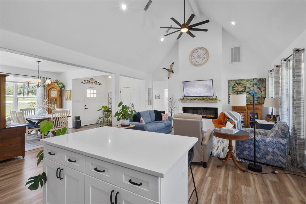 116 Lindsey Lane Runaway Bay, TX 76426 - Photo 13 of 35 a living room with furniture kitchen view and a large window