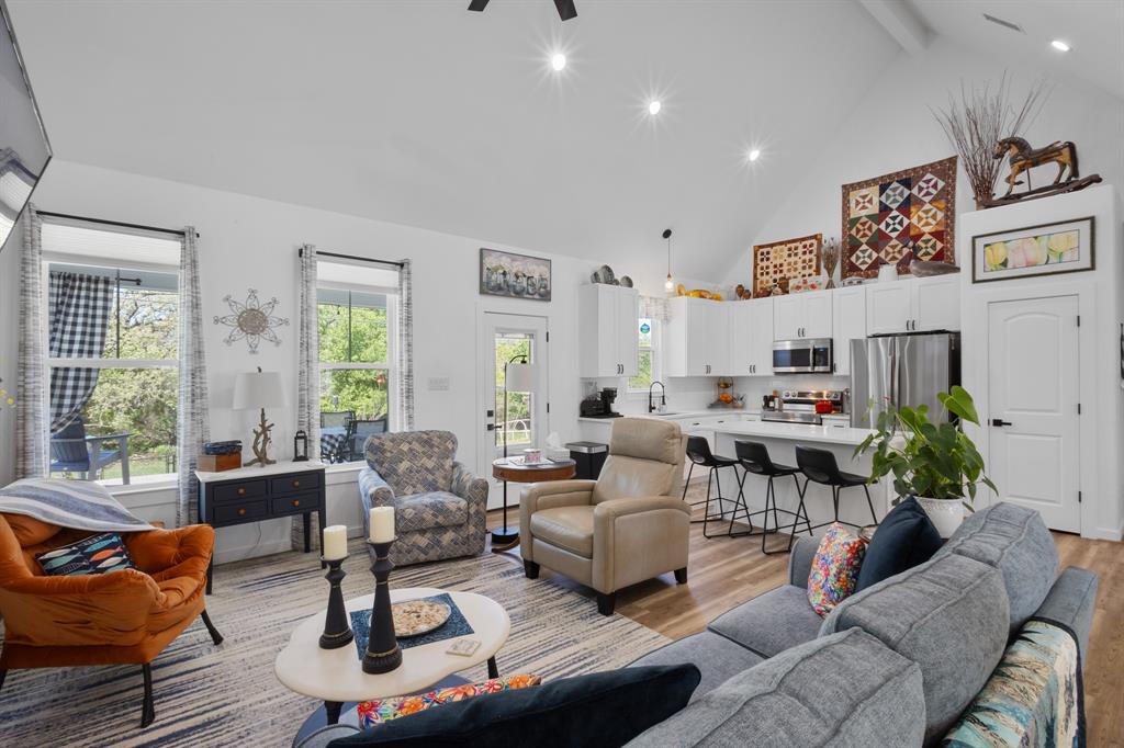 116 Lindsey Lane Runaway Bay, TX 76426 - Photo 18 of 35 a living room with furniture fireplace and a large window