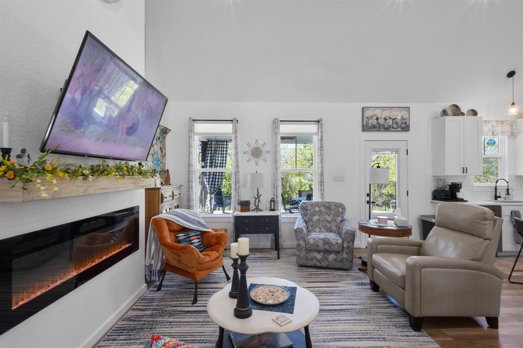 116 Lindsey Lane Runaway Bay, TX 76426 - Photo 19 of 35 a living room with furniture and a fireplace