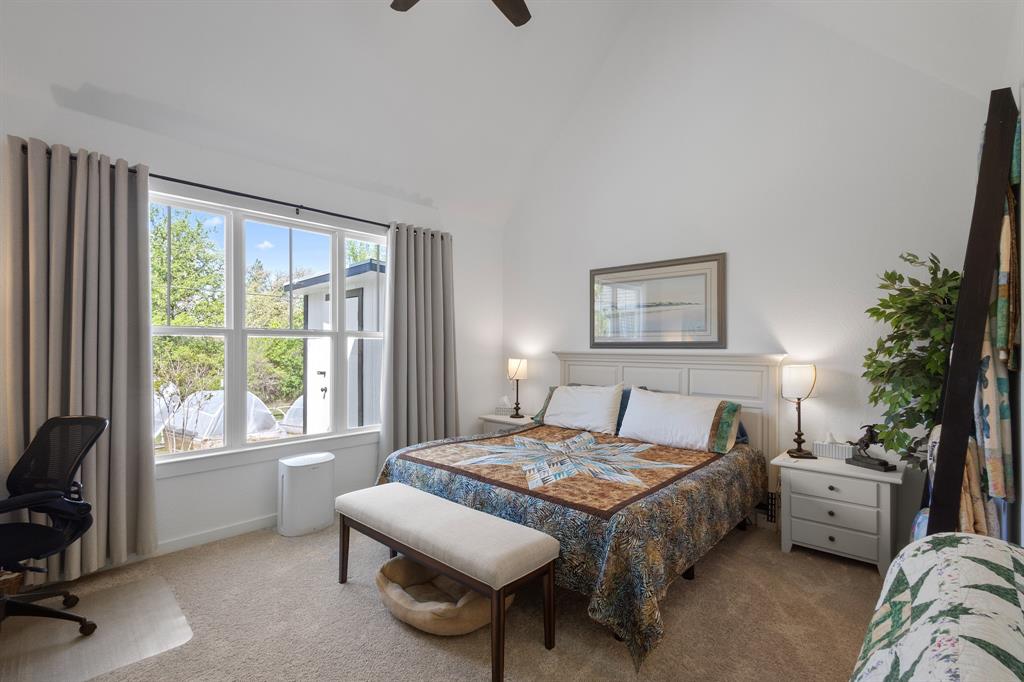 116 Lindsey Lane Runaway Bay, TX 76426 - Photo 24 of 35 a bedroom with a bed and a window