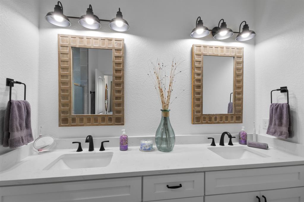 116 Lindsey Lane Runaway Bay, TX 76426 - Photo 27 of 35 a bathroom with a sink and a mirror