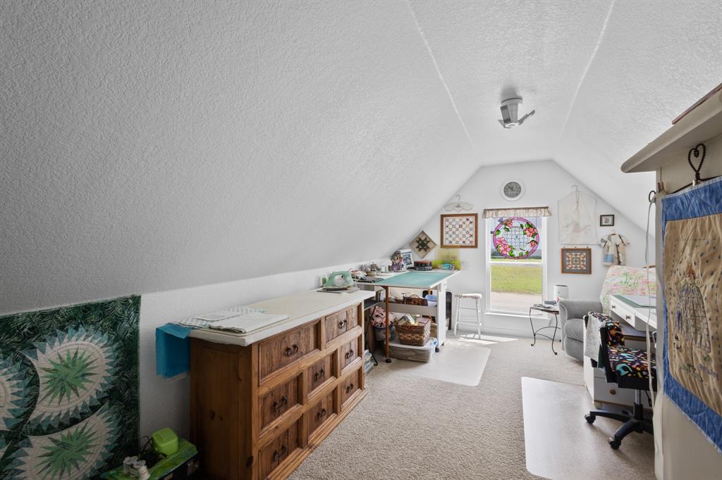 116 Lindsey Lane Runaway Bay, TX 76426 - Photo 30 of 35 a view of a workspace with furniture and a living room
